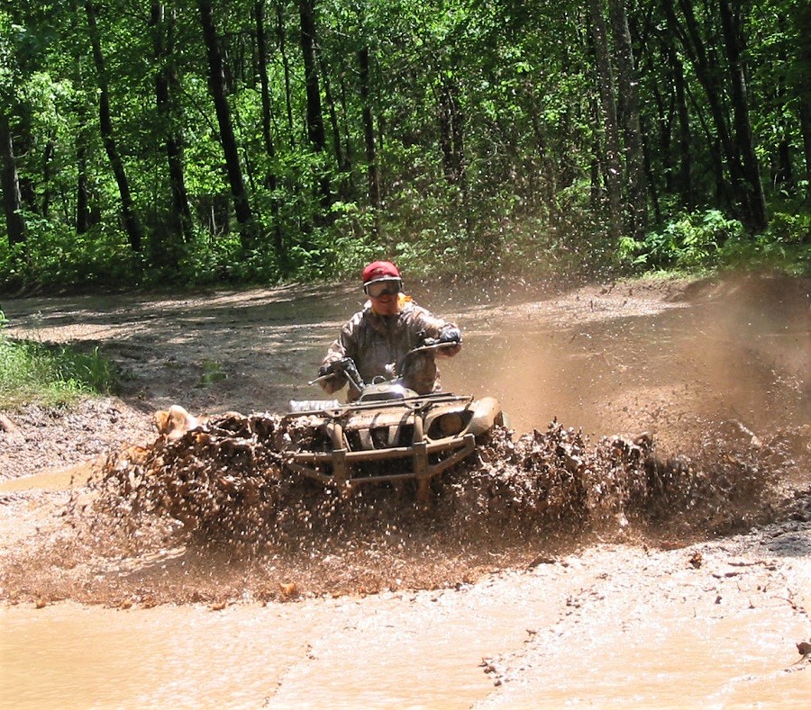 Wisconsin ATV Campgrounds: ATVer riding through mud